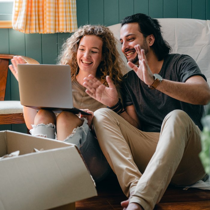 Happy man and woman with box