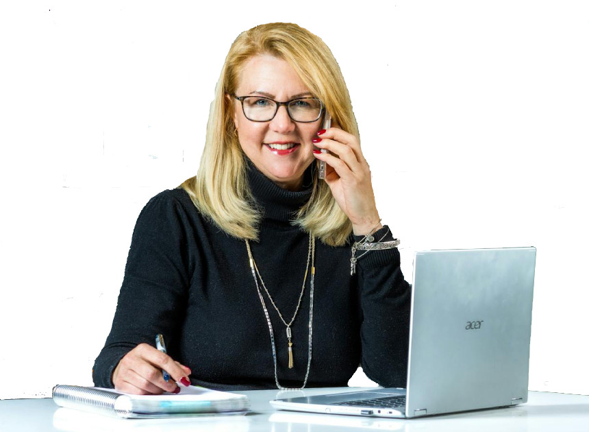 Lady smiling with phone pen and laptop